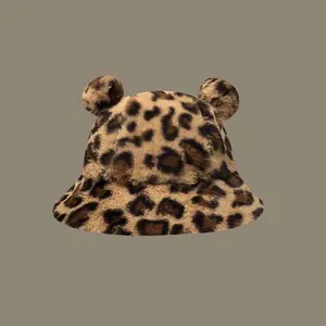 Cute leopard print bucket hat with bear ears for winter warmth and style.