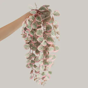 Artificial variegated hanging plant with pink and green heart-shaped leaves for decor.