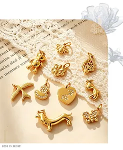 Close-up of various 18K gold plated animal charms including bears, ducks, and hearts