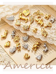 Close-up detail of various 18K gold plated animal charms for DIY jewelry making