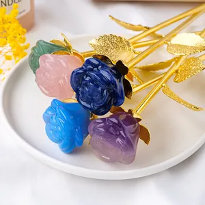 Handcrafted crystal roses with golden stems in pink, purple, and blue.