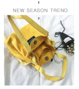 Close-up of small yellow canvas bucket bag interior and magnetic closure detail