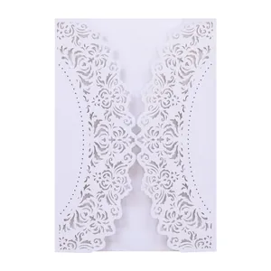 Detailed view of the intricate laser-cut floral pattern on a white invitation card