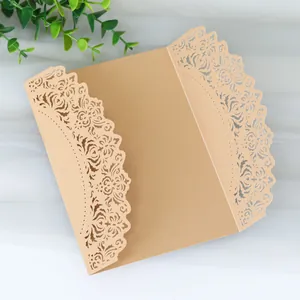 Detailed macro view of laser-cut lace pattern on kraft paper wedding invitation card