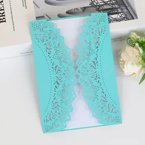 Elegant laser-cut turquoise wedding invitation card with intricate floral patterns