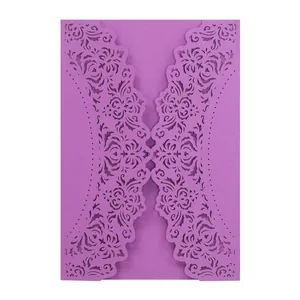 Detailed view of elegant purple laser-cut lace pattern on wedding invitation