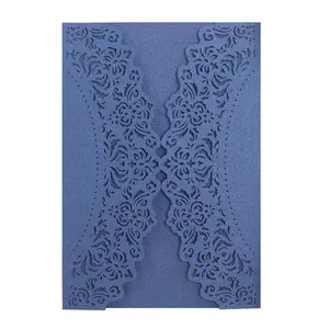 Detailed close-up of a navy blue laser-cut floral pattern wedding invitation card cover