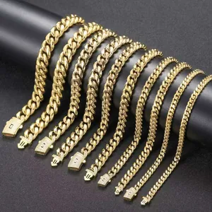 Detailed view of varying widths of 14K gold stainless steel Cuban link necklaces.