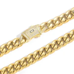 Close-up of gold Cuban link necklace with zircon-encrusted clasp detail