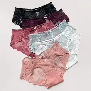 Vista detallada de varios colores de bragas de encaje y malla para mujer de talle bajo