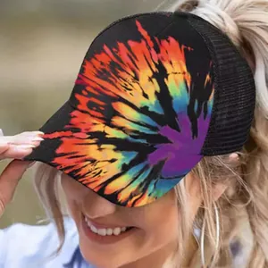 Detailed macro shot of the vibrant tie-dye pattern on this ponytail mesh cap