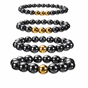 Detailed view of black and gold stainless steel beaded elastic bracelets for men.
