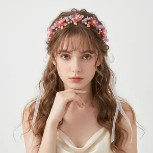 Elegant pink acrylic floral wreath headband with white ribbons for forest style weddings