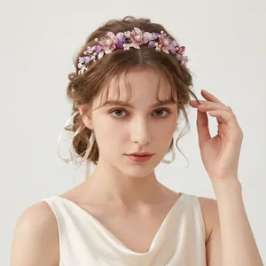 Elegant acrylic floral headband for weddings with pink and purple flowers and pearls