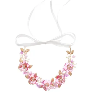 Elegant pink acrylic floral headband with faux pearls and gold leaves for weddings