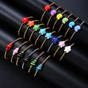 Multi-color stainless steel beaded bracelets with ocean-themed charms.
