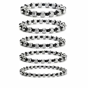 Set of five unisex textured stainless steel beaded bracelets on white background