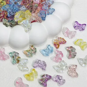Detailed macro shot of 14x10mm colorful translucent glass bow beads for DIY craft making