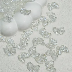 Detail view of 14x10mm translucent glass bow beads for DIY jewelry making and crafts