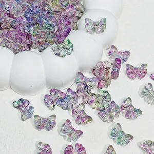 Close-up of 14x10mm iridescent glass bowknot beads for handmade jewelry crafts