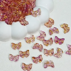 Macro view of 14x10mm colorful glass bow beads for handmade jewelry DIY crafts
