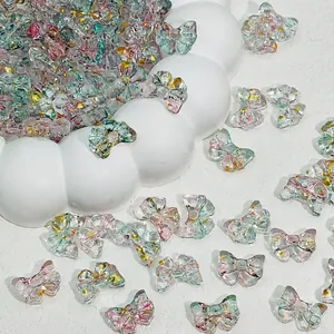 Close-up of 14x10mm glass bow beads with gold foil for DIY jewelry making accessories