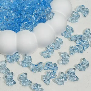 Close-up detail of 14x10mm blue transparent glass bow beads for DIY jewelry making
