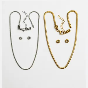 Detail view of DIY stainless steel snake chain bracelet components in gold and silver