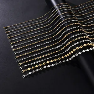 Detail view of various stainless steel DIY chains in gold, silver, and black tones.