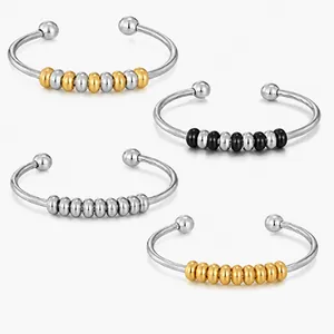 Detailed view of multiple 304 stainless steel wire cuff bracelets featuring colored beads