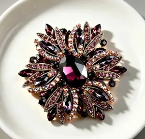 Macro view of a luxury vintage flower brooch featuring elegant purple crystals and rhinestones