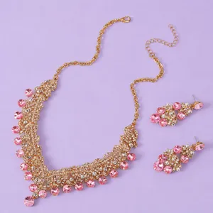 Elegant golden bridal jewelry set with pink rhinestones for evening parties and gala