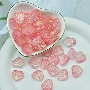 Detailed view of pink heart-shaped glass beads for handmade jewelry craft materials