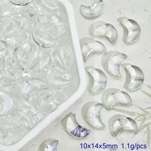 Macro detail of crescent moon-shaped clear glass beads for DIY jewelry crafts, 10x14x5mm