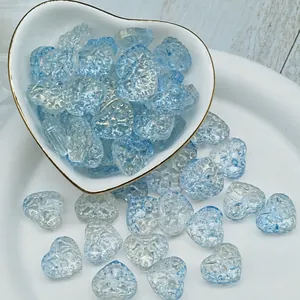 Close-up of 14x16x7mm light blue heart-shaped glass beads for DIY jewelry.