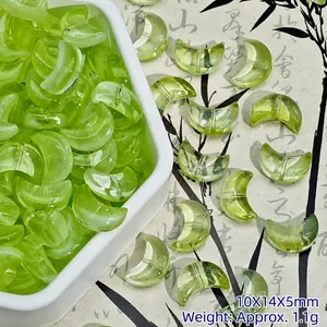 Detail of light green crescent moon glass beads for DIY jewelry making 10x14x5mm