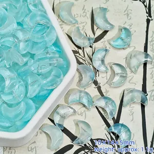 Detail of moon-shaped aqua glass beads with 10x14x5mm dimensions for DIY