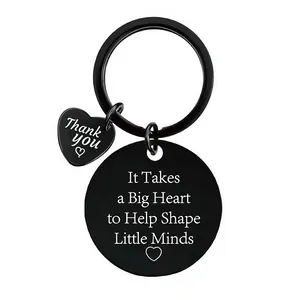 Close-up of black stainless steel teacher appreciation keychain with engraved heart charm