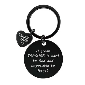 Detail view of black engraved teacher's day keychain with thank you heart