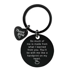 Detailed view of engraved black stainless steel keychain for teacher appreciation gift