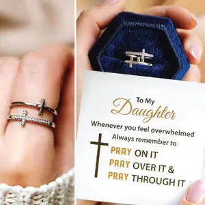Double cross ring with pavé crystals and emotional daughter gift card message.