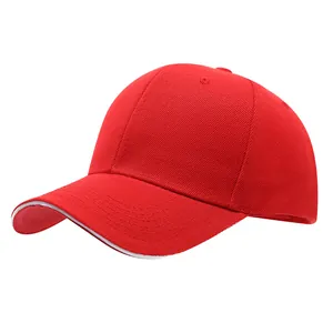 Classic red cotton baseball cap featuring white piping detail on the curved visor brim