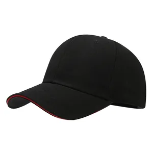 Close-up detail of a classic black baseball cap featuring a striking red sandwich brim.