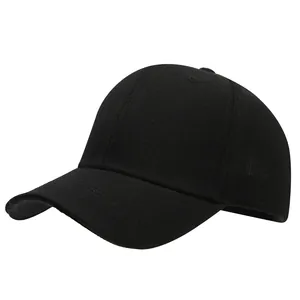 Close-up detail of a plain black cotton twill baseball cap with a classic curved brim design.