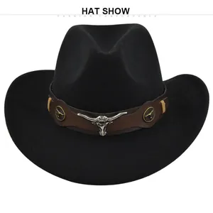 Detail view of the vintage black felt cowboy hat with bull head metal ornament and leather band