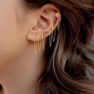 Chic gold-plated tassel chain earrings set with celestial and floral motifs for ear piercings