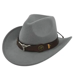 Close-up detail of a grey wool fedora hat with vintage western bull head decoration.