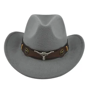 Close-up of grey felt cowboy hat featuring brown band and silver bull head decoration