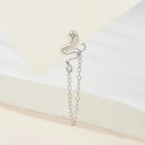 Close-up of S925 silver snake ear stud featuring a delicate chain tassel and stone