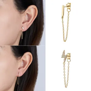 Close-up of S925 sterling silver gold-plated lightning and bar tassel chain earrings.